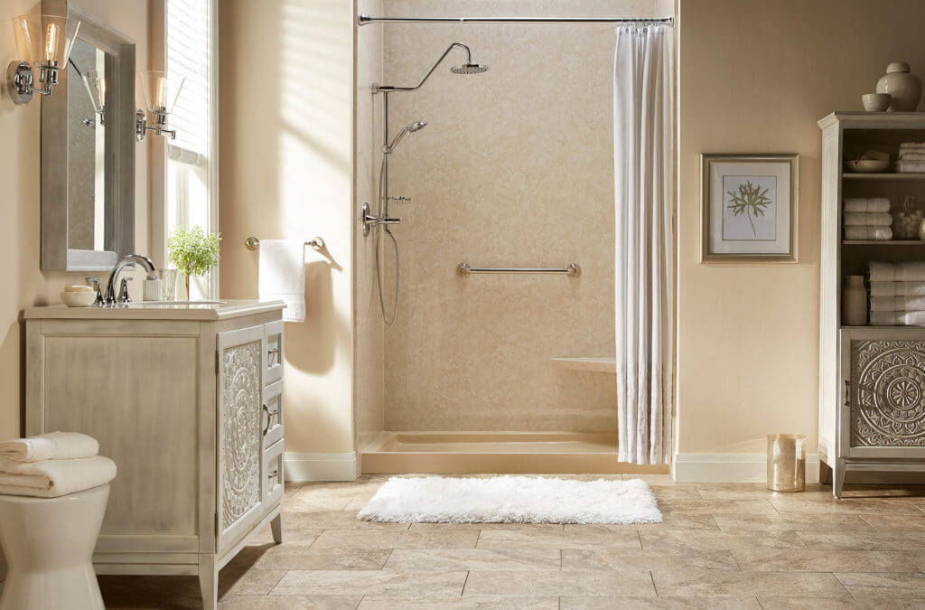 Remodeled bathroom with beige color scheme and walk-in shower